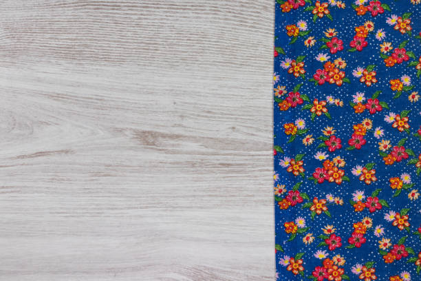 istock Pattern flower cloth napkin on empty wooden background. 873287206
