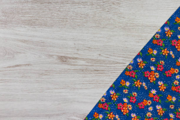 istock Pattern flower cloth napkin on empty wooden background. 873287220