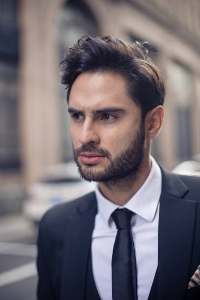 istock Elegant young gentleman in suit 873289478
