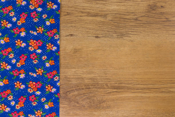 istock Pattern flower cloth napkin on empty wooden background. 873290078