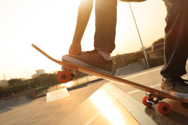 istock skateboarder legs skateboarding on skatepark ramp 873309792