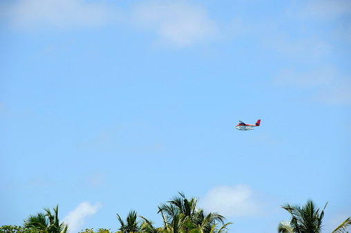 Helicopter air taxi flowing on sky in Maldives. March 18, 2012