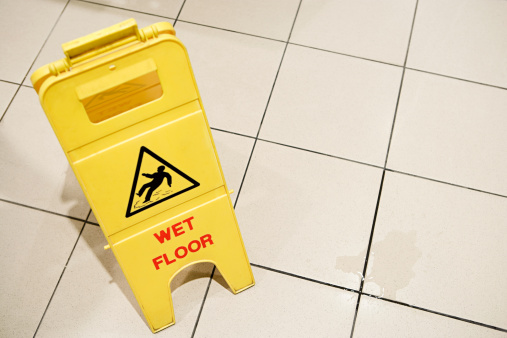 Sign for caution on a potentially slippery floor.