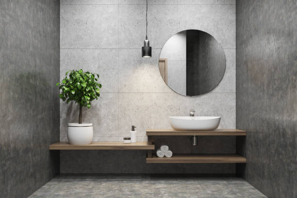 istock Concrete bathroom, sink, round mirror 873313724