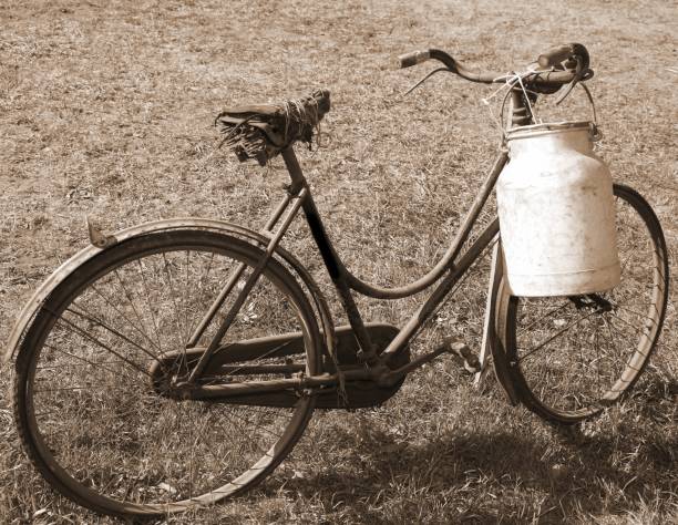 istock very old bicycle with a broken saddle and the milk can milkman 873315488