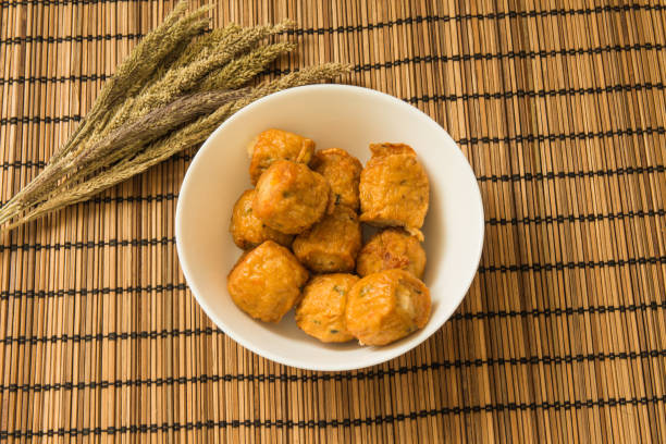 istock Jock fried chicken with a wooden texture on background 873316226