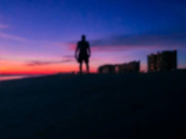 Blurred silhouette Man standinding on the beach with sunset background at Puerto Penasco (Rocky Point) Mexico.