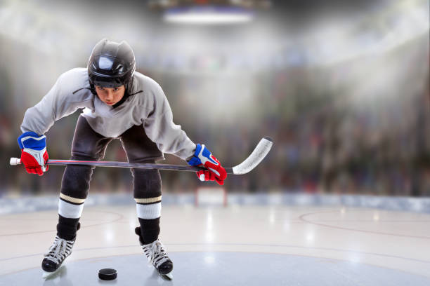 istock Junior Hockey Player Puck Handling in Arena 873331372