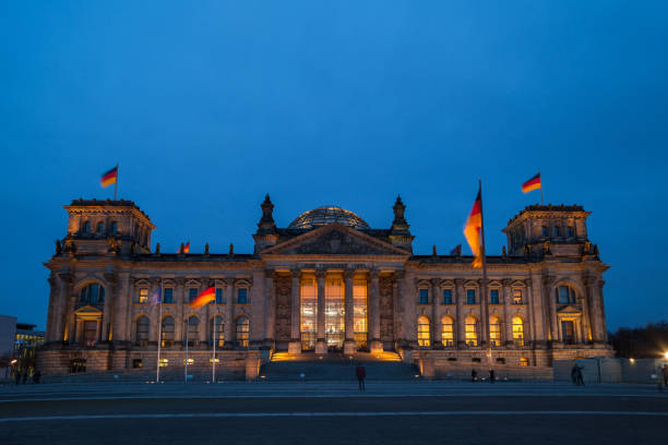 istock German parliament (Reichstag) building in Berlin, Germany. Night shot with illumination. 873332024
