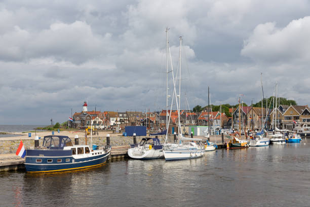 istock Harbor historic Dutch village Urk with modern sailing yachts 873332410