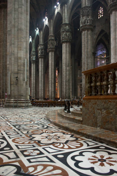 Inside Duomo cathedral in Milan Milan: Inside Duomo cathedral in Milan, detail of the decorated floor in candoglia marble with flower pattern candoglia marble stock pictures, royalty-free photos & images