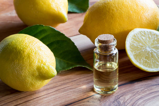 istock A bottle of lemon essential oil with lemons 873335906