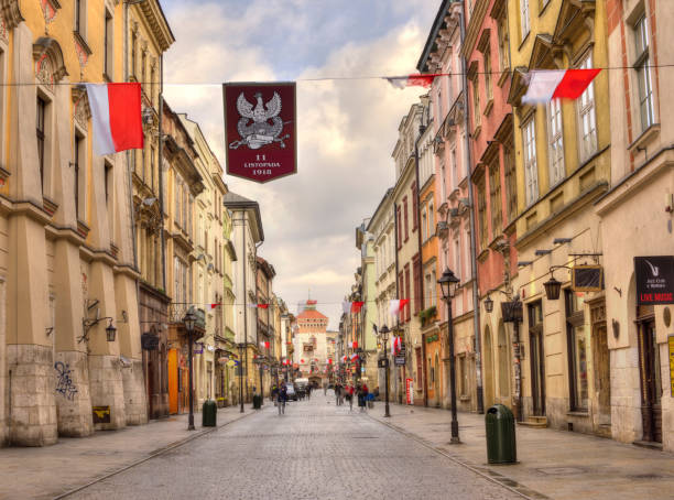 NOVEMBER 11, 2017 -  KRAKOW, POLAND:  Polish national flags hanging above a street in downtown Krakow in celebration of National Independence Day.  A national holiday in Poland, it is celebrated annually on November 11 to commemorate Poland's regaining independence in 1918.