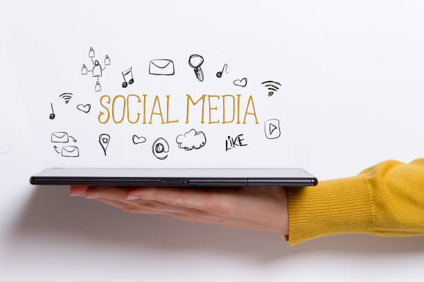 istock Social Media concept with woman holding a tablet computer 873338170