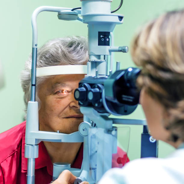 istock Senior woman visiting optician. 873338198