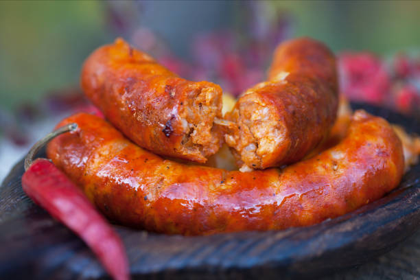 Chorizo sausages. Homemade spicy sausage on dark wooden plate