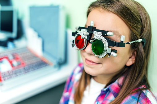 Girl is at the optometrist