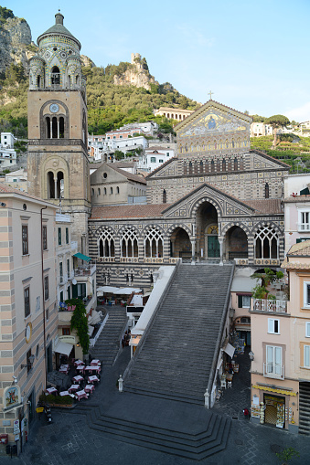 Apostle Saint Andrew Cathedral in Amalfi (Italy) - gold decorated facade with church stairway.