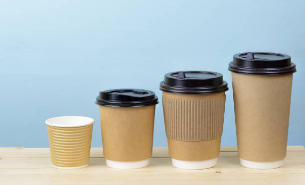 istock Paper coffee cups on a wooden table 873341696
