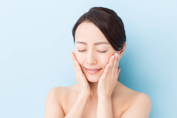 istock young asian woman beauty image isolated on blue background 873341804