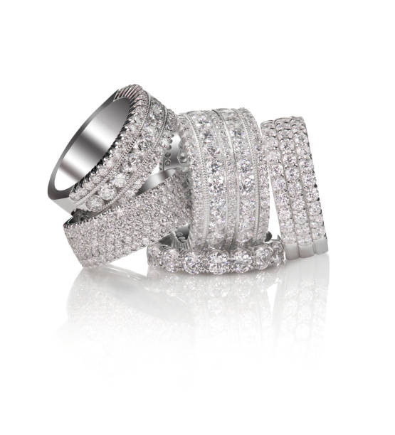 istock Set of diamond pave wedding band rings gemstone fine jewelry. Group stack or cluster of multiple gemstone diamond rings. 873358920