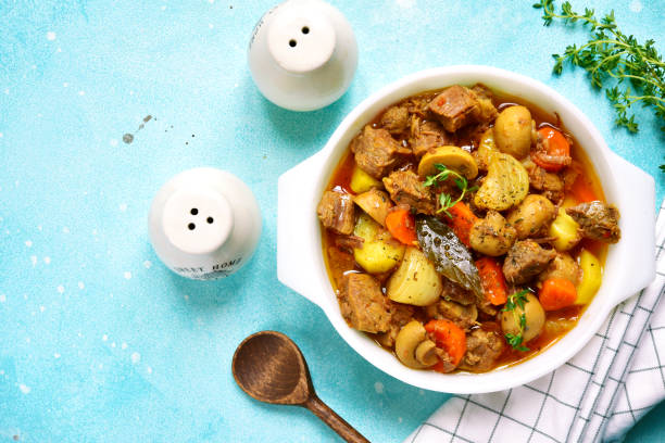 istock Slow cooker meat with vegetables in tomato sauce 873359144