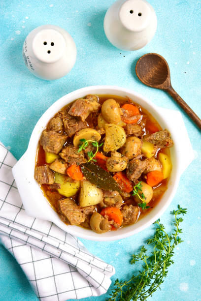 istock Slow cooker meat with vegetables in tomato sauce 873359196