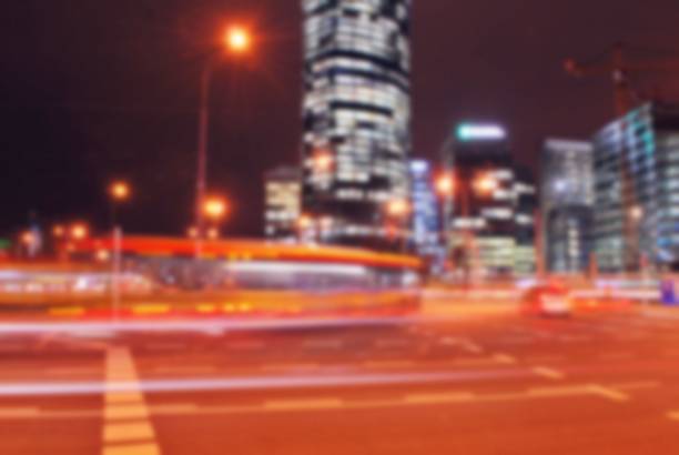 istock Night blurred bokeh light city office building, abstract background 873371400