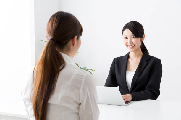 asian businesswoman talking in office asian businesswoman talking in office talking two people business talk business stock pictures, royalty-free photos & images