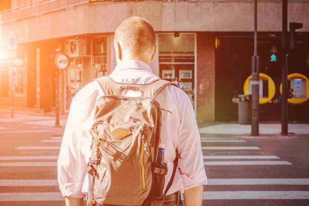 istock Traveler with backpack on the city street 873374630