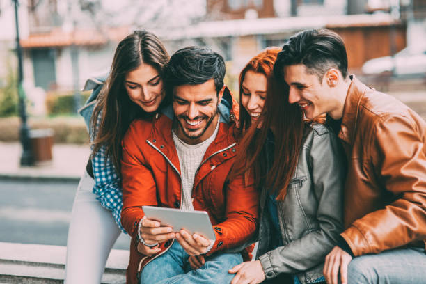 istock Friends using a tablet in the city 873375298