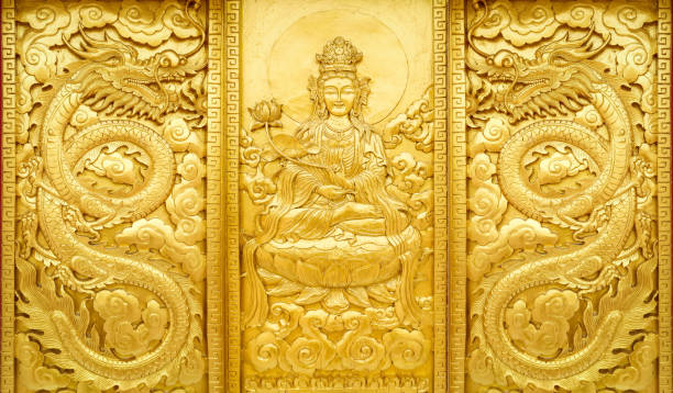 craft wooden with gold color of guan yin china god with dragon - asia religion statue chinese culture imagens e fotografias de stock