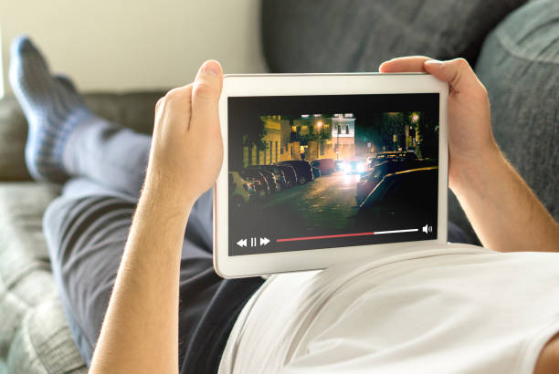 istock Online movie stream with mobile device. 873382496