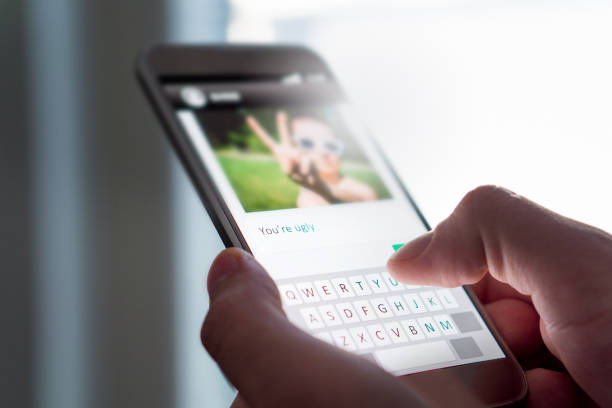 istock Cyber bullying, internet trolling and bad behavior online concept. 873384980