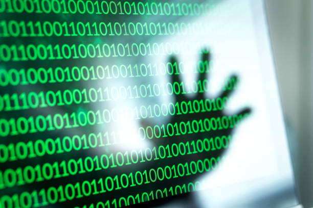 Cyber security threat and attack concept. Binary numbers, zero and one on laptop screen. Cyber security threat and attack concept. Binary numbers, zero and one on laptop screen. Reflection of hacker hand in computer monitor. zero errors stock pictures, royalty-free photos & images