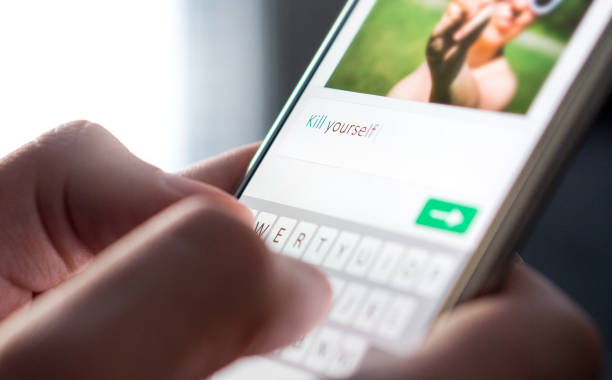 istock Cyber bullying, internet trolling and bad behavior online concept. 873384992