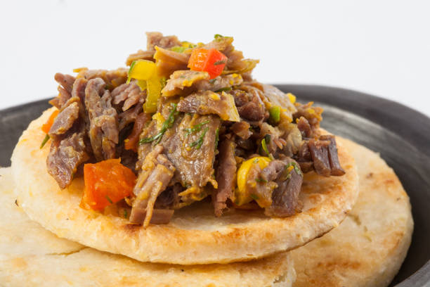 istock Colombian arepa topped with shredded beef 873385052