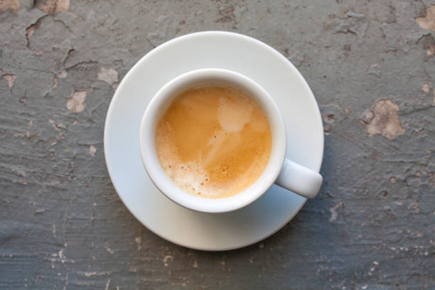 istock Cup of coffee esspresso, top view on grey grunge background 873386392