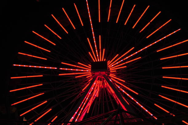istock Abstract of ferries wheel with red light 873388578
