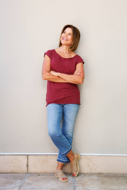 istock happy woman smiling and looking up 873392972