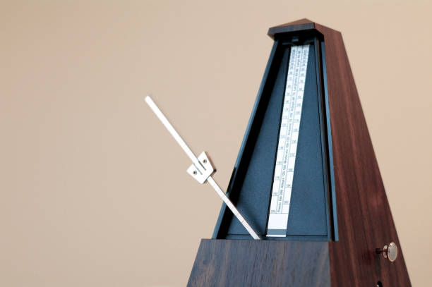 istock Metronome in action isolated and on a plain background 873395836