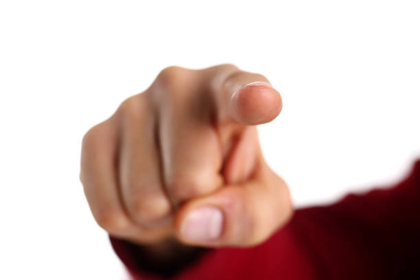 istock Male arm show forefinger in camera closeup 873397434