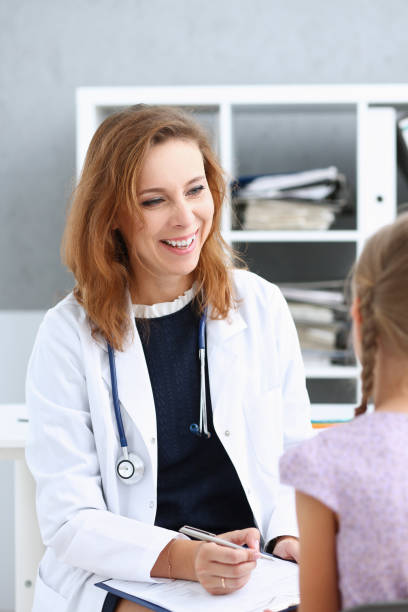 istock Little child at pediatrician reception 873397676