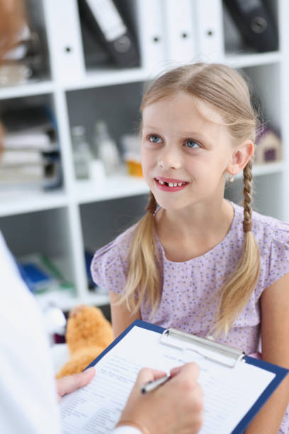 istock Little child at pediatrician reception 873397706