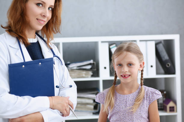 istock Little child at pediatrician reception 873397712