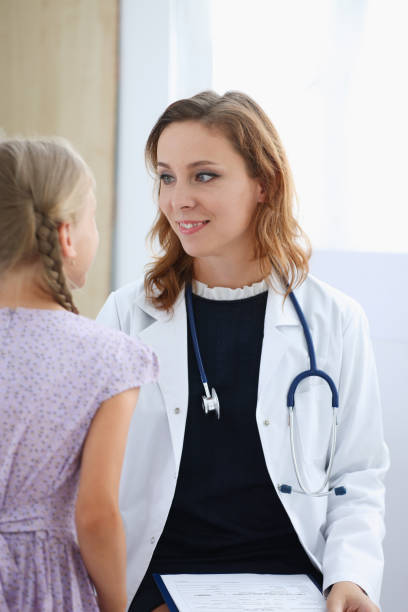 istock Little child at pediatrician reception 873397722