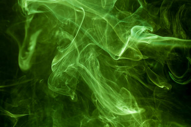 istock Green smoke on a black background. smoke on a black background. 873406024