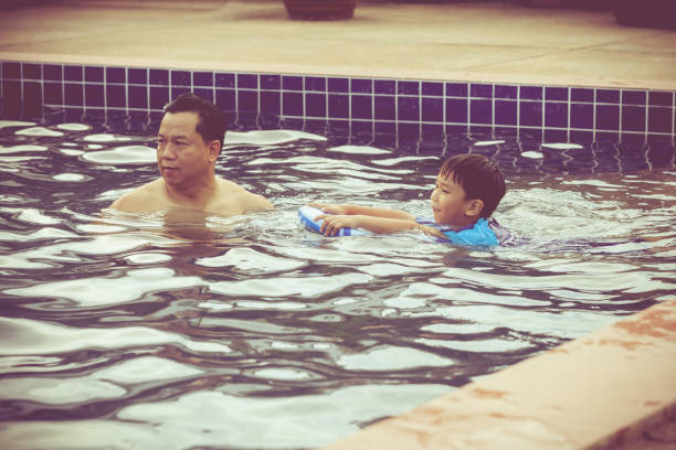 istock Parent and child playing outdoors. Summer vacation concept 873412142
