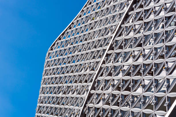 istock Abstract close up of modern exterior architectural metal wall pattern background. 873425690