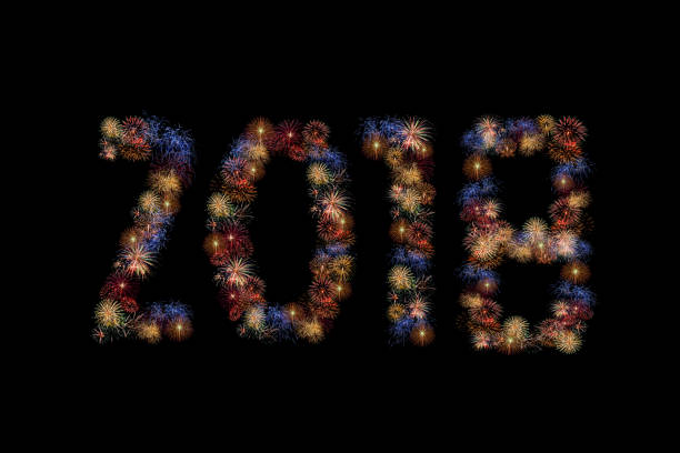istock Colour fireworks forming new year 2018 AD on black background. 873425776